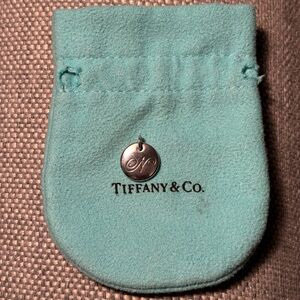 Tiffany letter N notes alphabet disc charm in sterling silver